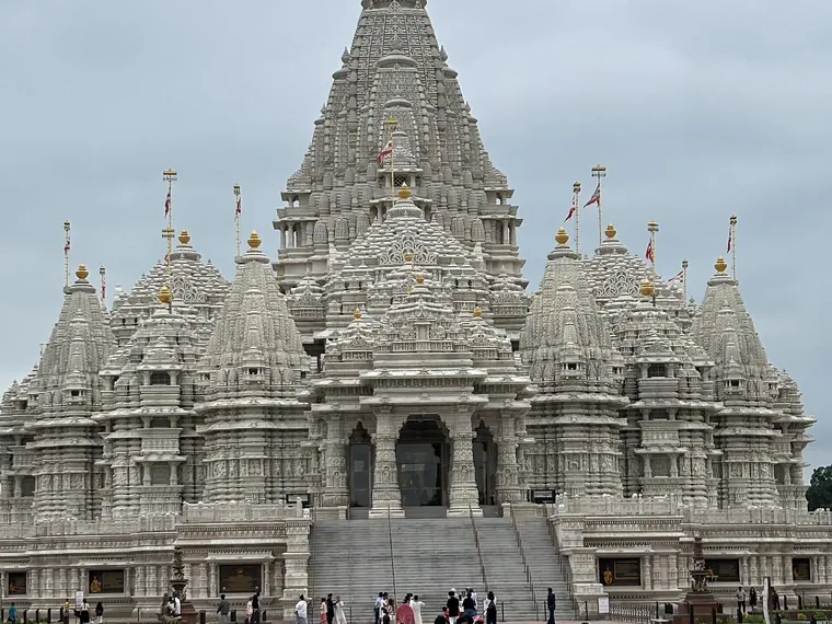 The carved stone mandir of BAPS Swaminarayan Akshardham at Robbinsville, New Jersey, seen across its forecourt
