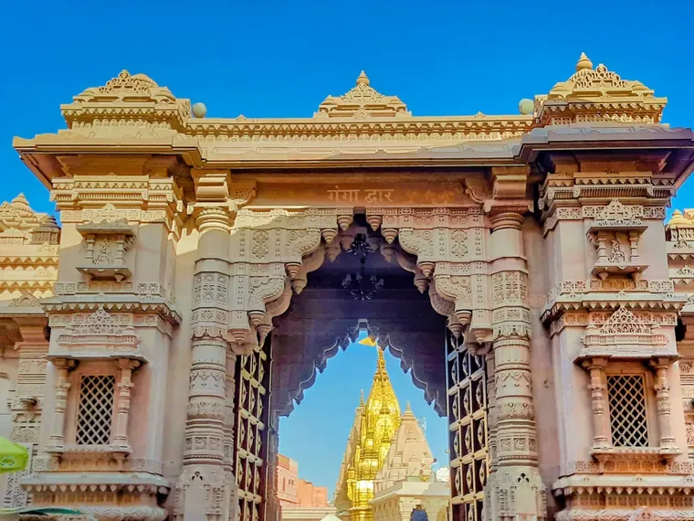The Ganga Dwar gateway of the Kashi Vishwanath Corridor in Varanasi with the golden shikhara visible through the arch